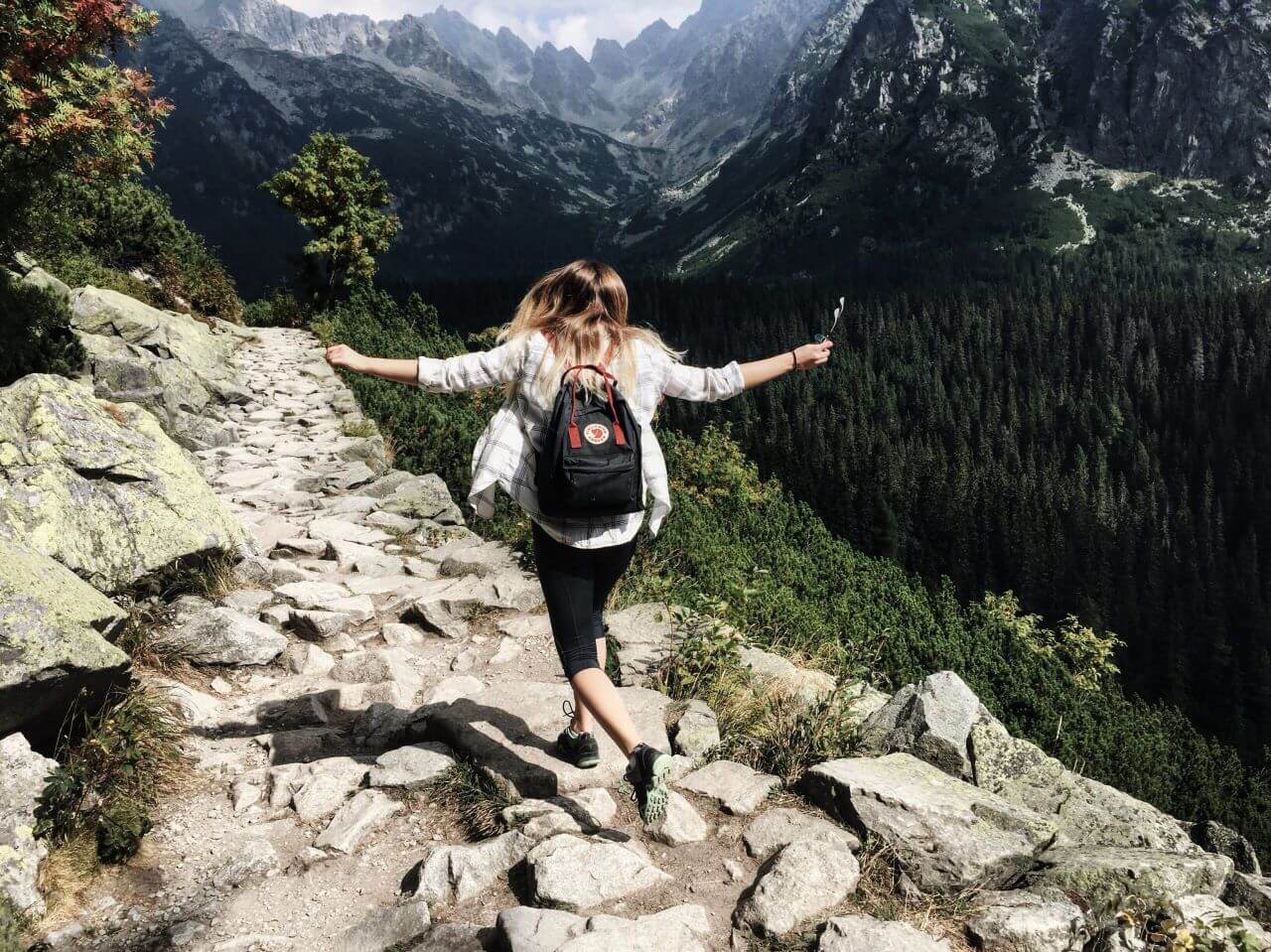 A woman hiking in the mountains